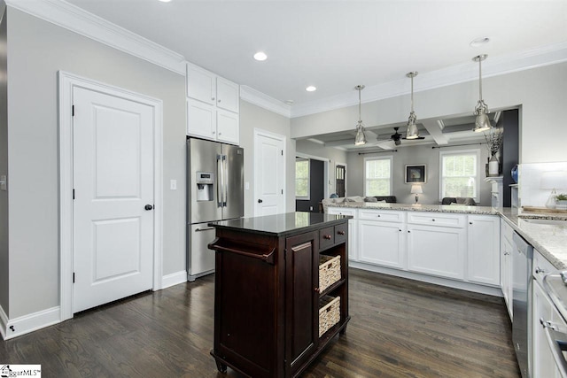 kitchen featuring kitchen peninsula, appliances with stainless steel finishes, white cabinetry, and dark wood-type flooring