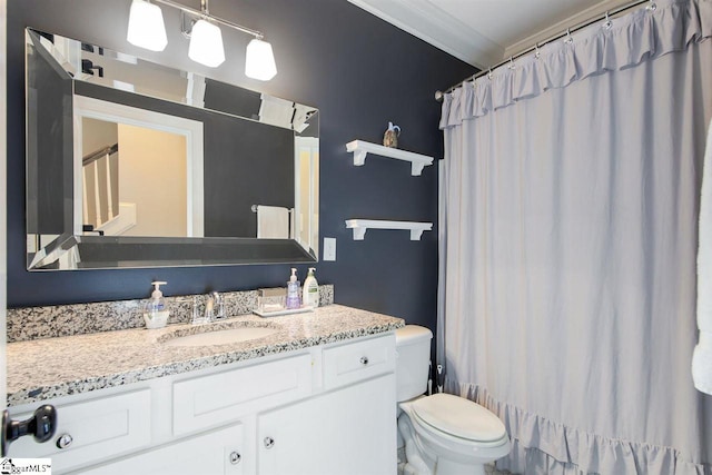 full bathroom featuring vanity, shower / bath combo, toilet, and crown molding