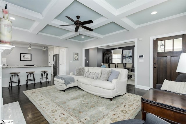 living room with beamed ceiling, dark hardwood / wood-style floors, and coffered ceiling