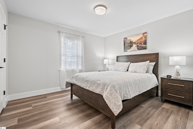 bedroom with wood-type flooring