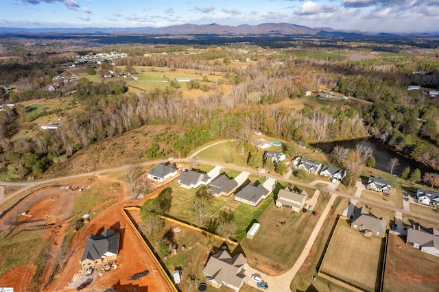 birds eye view of property with a mountain view