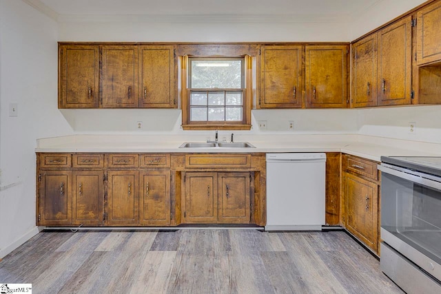 kitchen with stainless steel range with electric stovetop, white dishwasher, crown molding, sink, and light hardwood / wood-style floors