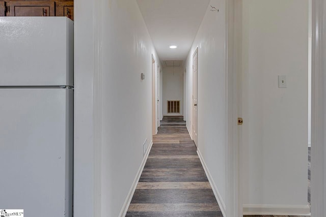 corridor featuring dark wood-type flooring