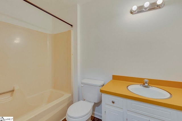 full bathroom with washtub / shower combination, vanity, and toilet