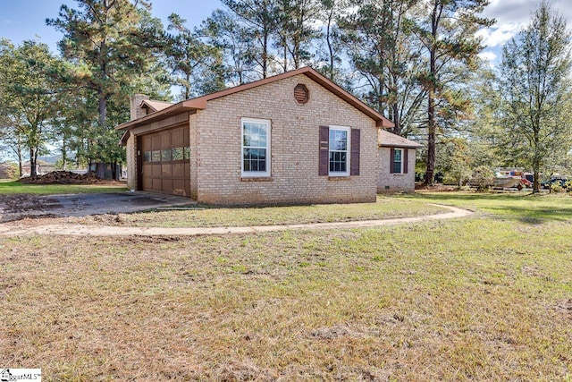 view of home's exterior featuring a yard and a garage