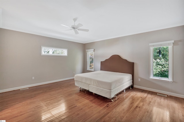 124 Bradley Park, Anderson, SC 29621 - bedroom with wood finished floors, crown molding, multiple windows, and baseboards