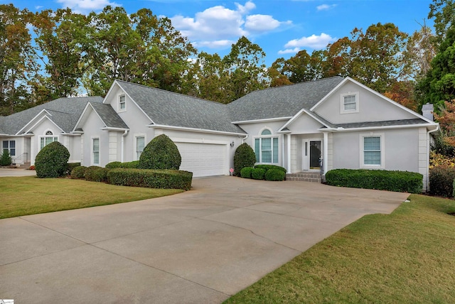 view of front facade featuring a front yard and a garage