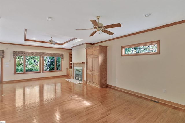 124 Bradley Park, Anderson, SC 29621 - unfurnished living room with a ceiling fan, ornamental molding, healthy amount of natural light, light wood-type flooring, and baseboards