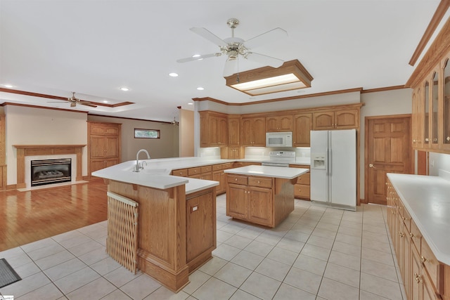124 Bradley Park, Anderson, SC 29621 - kitchen featuring white appliances, a ceiling fan, a sink, light tile patterned flooring, and a center island