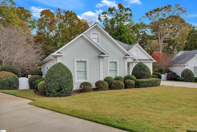124 Bradley Park, Anderson, SC 29621 - traditional-style home with stucco siding, a front lawn, and driveway