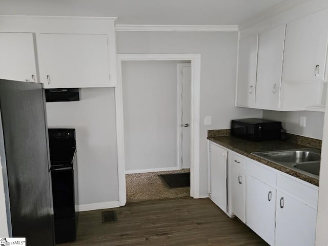 kitchen featuring sink, dark hardwood / wood-style flooring, white cabinetry, and black appliances