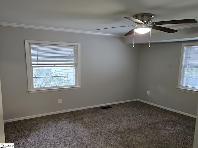 empty room with carpet flooring, ceiling fan, and crown molding