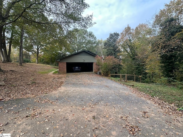 view of side of home with a garage