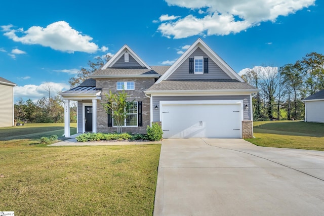 craftsman-style house featuring a garage and a front yard