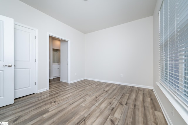 unfurnished bedroom with light hardwood / wood-style flooring