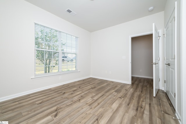 unfurnished room featuring light hardwood / wood-style floors