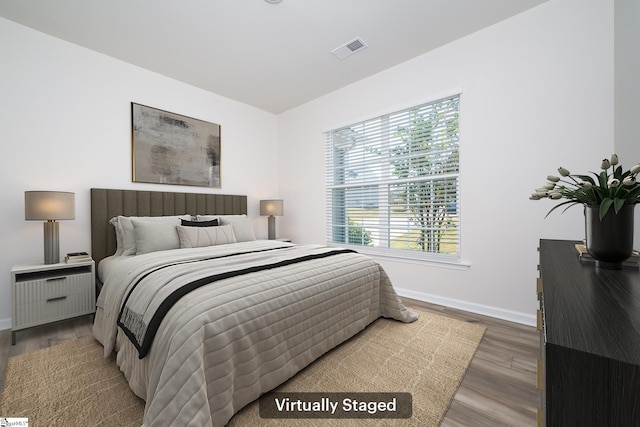 bedroom featuring wood-type flooring