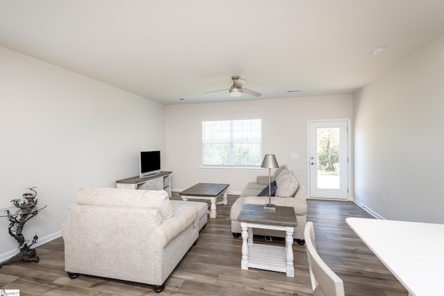 living room with hardwood / wood-style floors and ceiling fan