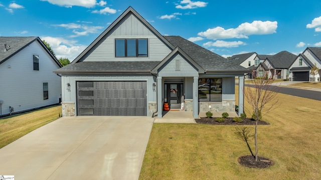 view of front facade with a porch, a garage, and a front lawn