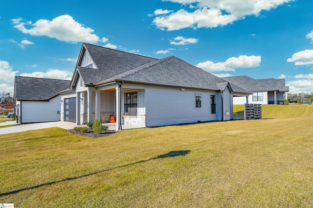 exterior space featuring a yard and a garage