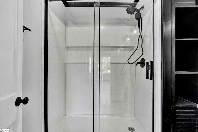 bathroom featuring an enclosed shower