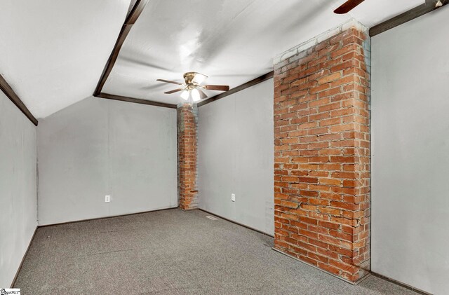 spare room featuring carpet flooring, ceiling fan, lofted ceiling, and ornamental molding