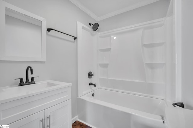 bathroom featuring vanity, ornamental molding, and bathing tub / shower combination