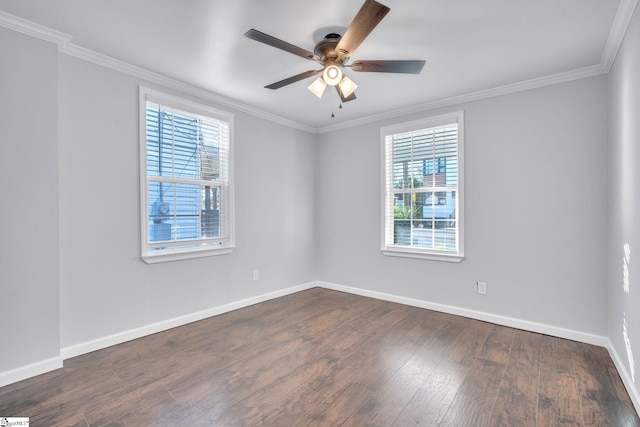 unfurnished room featuring a wealth of natural light, crown molding, ceiling fan, and dark wood-type flooring