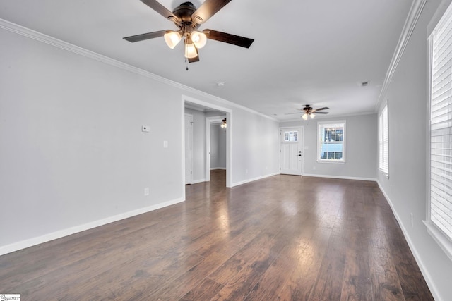 empty room with dark wood-type flooring, ceiling fan, and ornamental molding