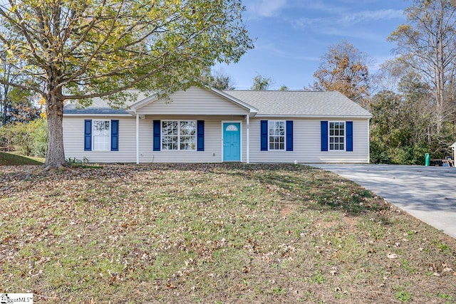 ranch-style house with a front yard