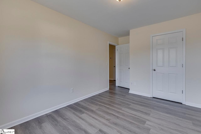 unfurnished bedroom featuring light wood-type flooring