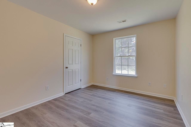 unfurnished room featuring light wood-type flooring