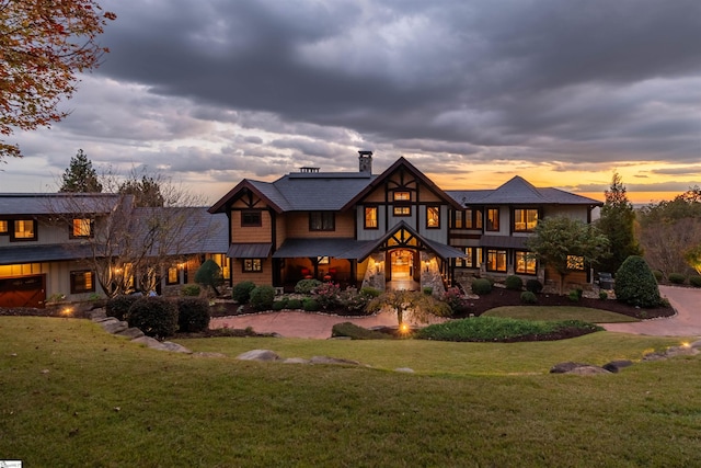 view of front of property with a yard