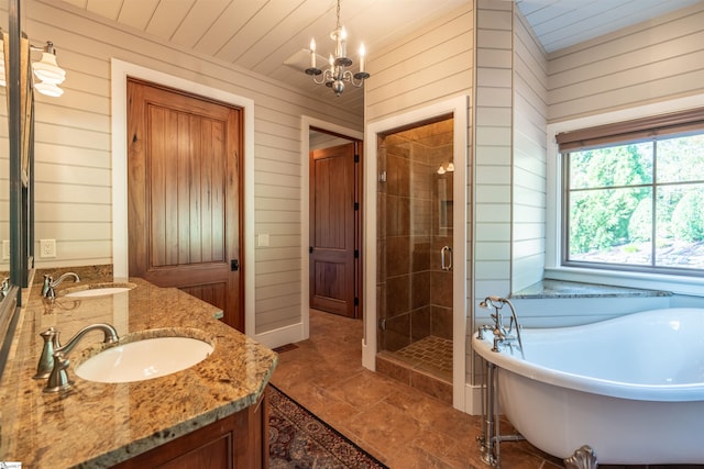 bathroom with wooden walls, tile patterned flooring, vanity, and independent shower and bath