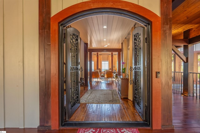 interior space featuring wooden ceiling and dark wood-type flooring