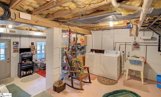 basement featuring washer and clothes dryer and a healthy amount of sunlight