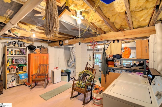 basement with washing machine and clothes dryer