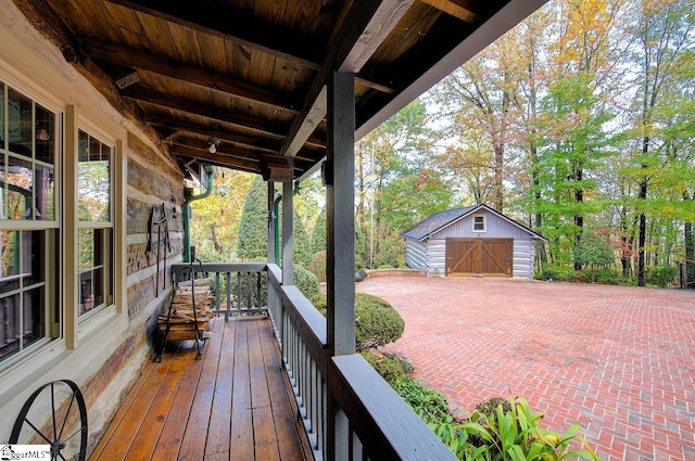 wooden deck featuring an outdoor structure