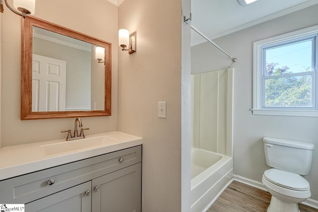 full bathroom with vanity, shower / washtub combination, crown molding, hardwood / wood-style flooring, and toilet