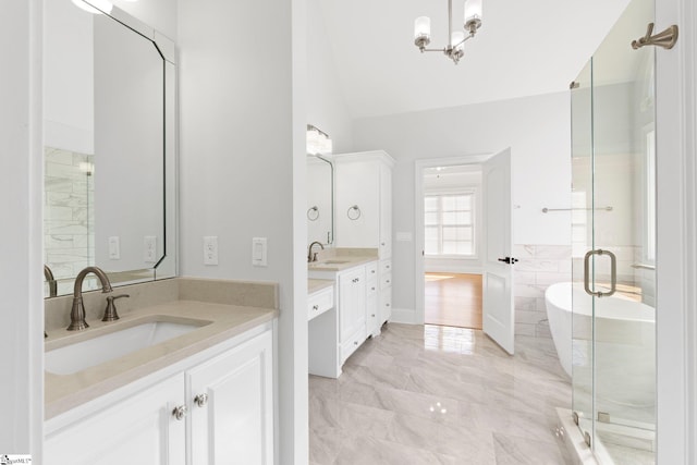 bathroom featuring separate shower and tub, tile walls, vanity, and lofted ceiling