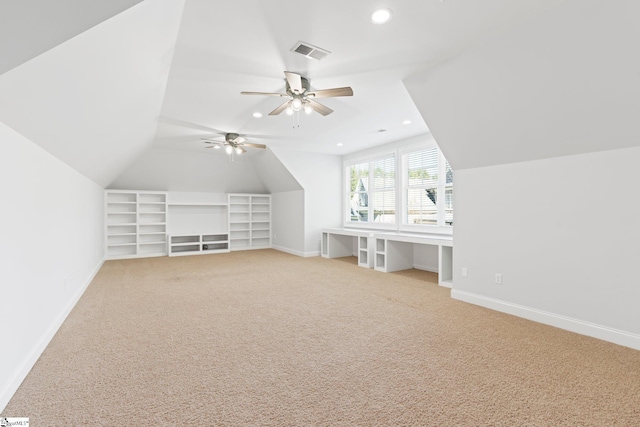 additional living space with carpet, ceiling fan, and lofted ceiling