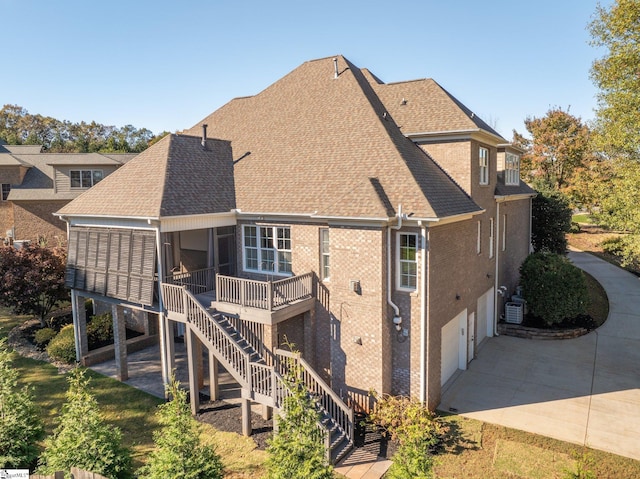 back of property featuring cooling unit and a patio