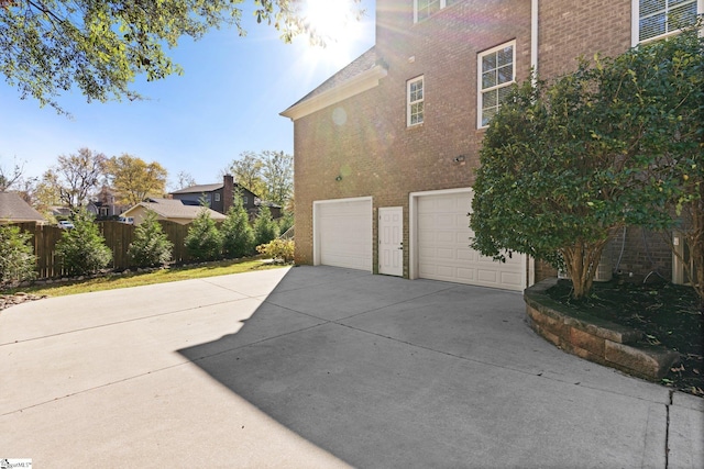 view of property exterior with a garage