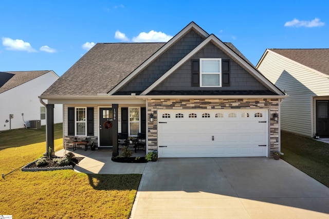 craftsman-style home with a porch, central AC unit, and a front yard