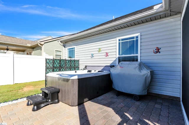 view of patio with a hot tub and grilling area