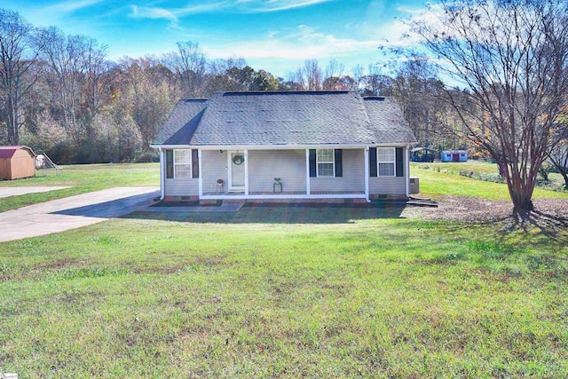 ranch-style home with a porch and a front yard