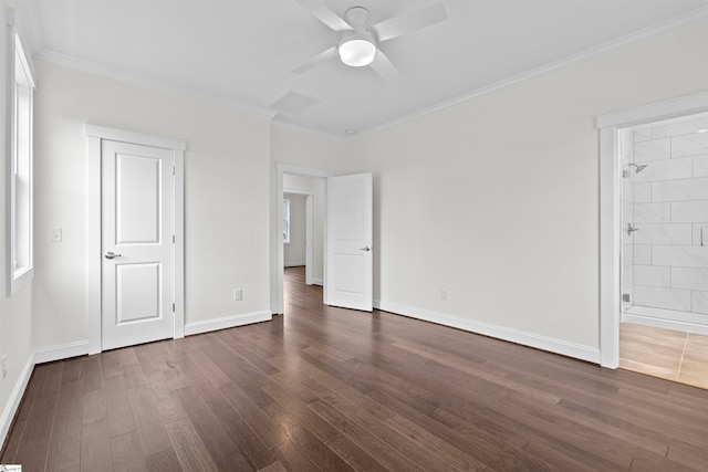 unfurnished bedroom featuring dark hardwood / wood-style floors, ceiling fan, crown molding, and ensuite bathroom