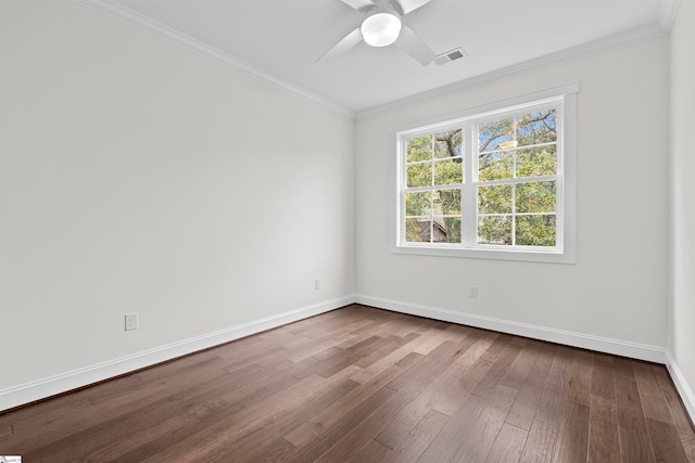 unfurnished room featuring hardwood / wood-style flooring, ceiling fan, and crown molding