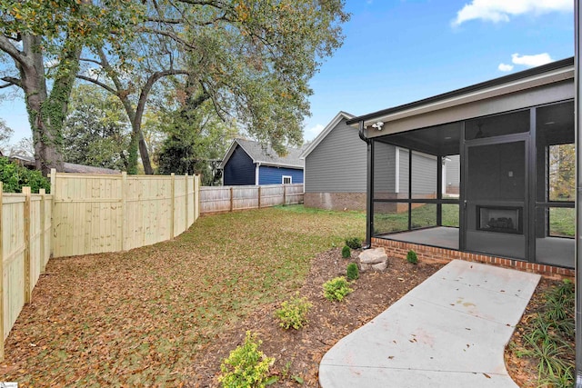 view of yard featuring a sunroom