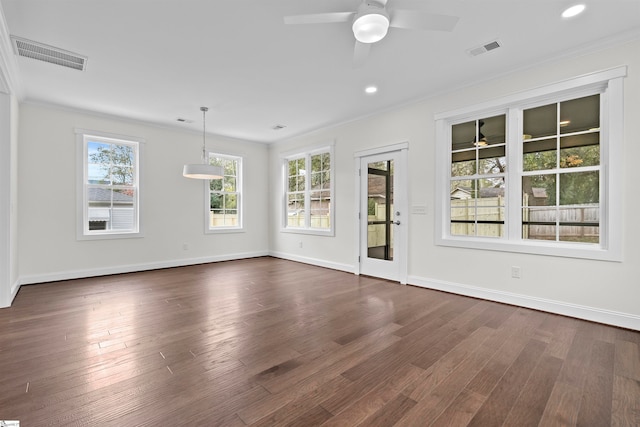 interior space featuring ceiling fan, dark hardwood / wood-style flooring, and crown molding